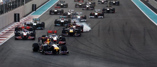 Vettel leads into the first corner in Abu Dhabi, but seconds later his right-rear tyre suddenly deflated and his race was over - Photo Credit: Mark Thompson/Getty Images