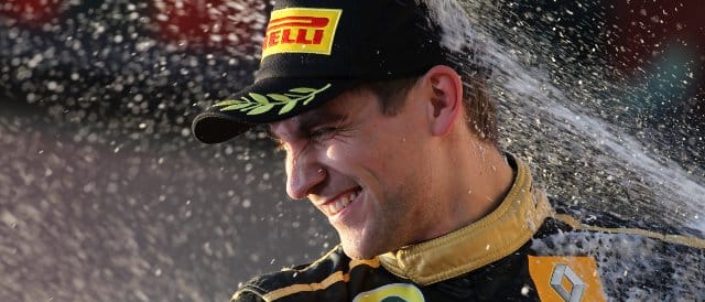 Petrov feels the spray of champagne after finishing on the podium in Australia - his best result of 2011 - Photo Credit: Lorenzo Bellanca/LAT Photographic 