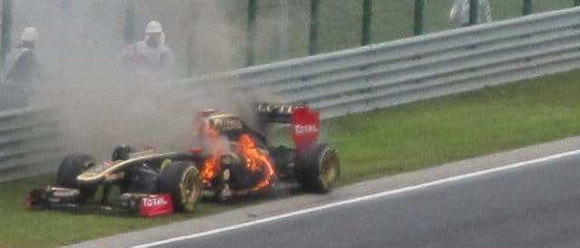 Nick Heidfeld's Renault caught fire in Hungary, as seen from the first corner grandstand - Photo Credit: David Bean