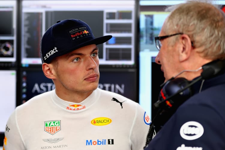 Max Verstappen of Netherlands and Red Bull Racing talks with Red Bull Racing Team Consultant Dr Helmut Marko in the garage