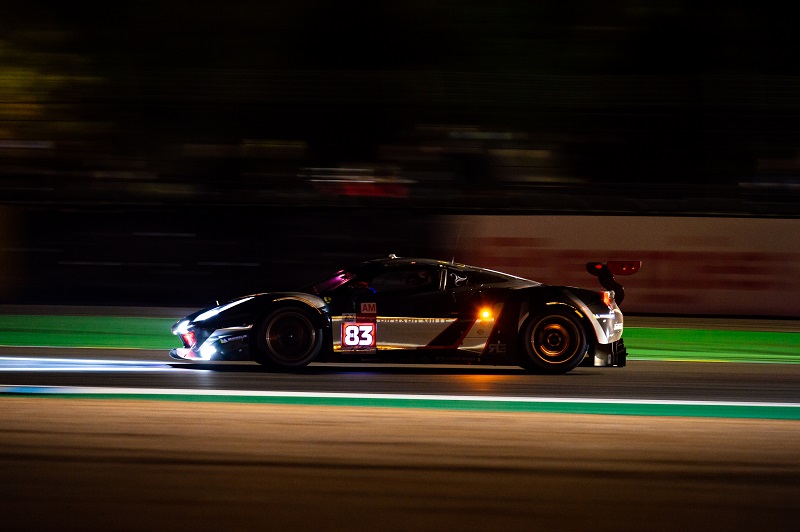 The LM GTE Am class-winning and championship-winning #83 AF Corse racing at night at the Bapco 8 Hours of Bahrain